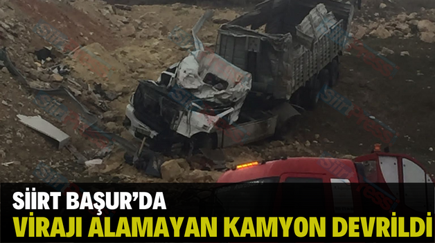 SİİRT BAŞUR’DA VİRAJI ALAMAYAN KAMYON DEVRİLDİ